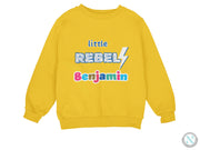 a yellow sweatshirt with the words'little rebell'printed on it