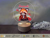 a glass plate with a picture of a red panda on it