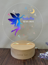 a clear acrylic plaque with a fairy on it