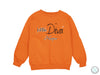 an orange sweatshirt with the words little diva on it