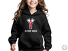 a young girl wearing a black hoodie with the words y is for yara