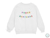 a white sweatshirt with the words happy birthday printed on it