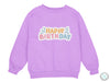 a purple sweatshirt with the words happy birthday on it