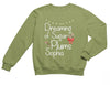 a green sweatshirt with the words dreaming of sugar plums and a bow