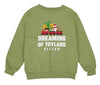 a green sweatshirt with a christmas train on it